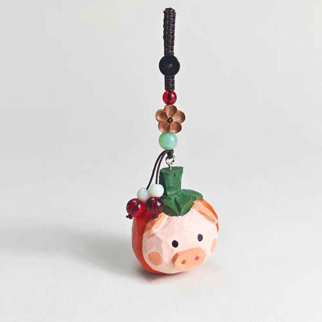 Lucky Pumpkin Pig Wooden Charm – Hand Carved Pig Keychain with Peace Bead, Cute Bag & Car Hanging Ornament